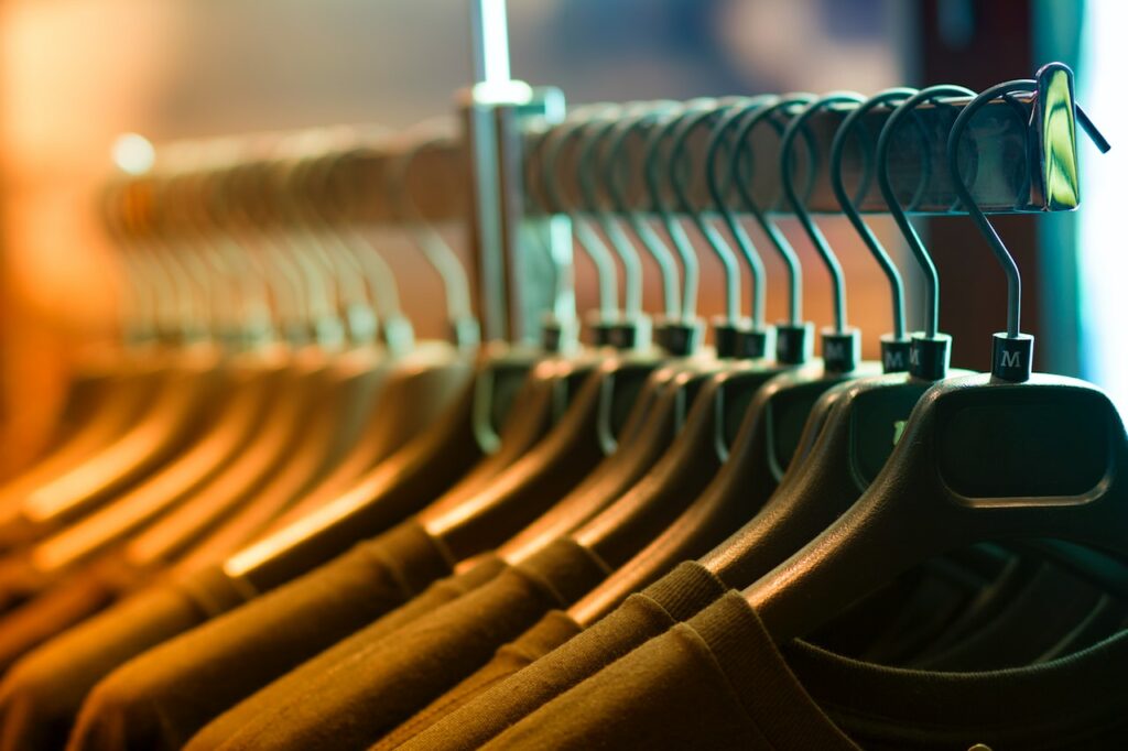 A rack of dark-colored clothes