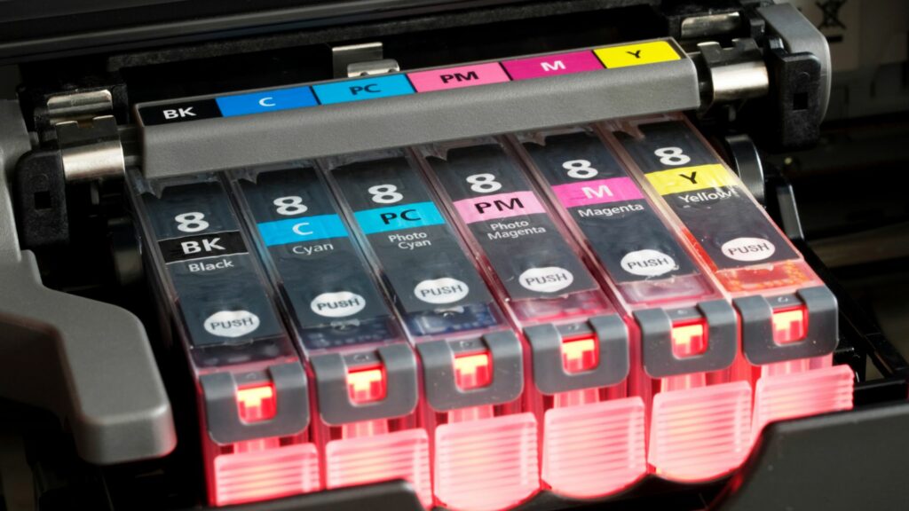 CMYK ink cartridges in a printer