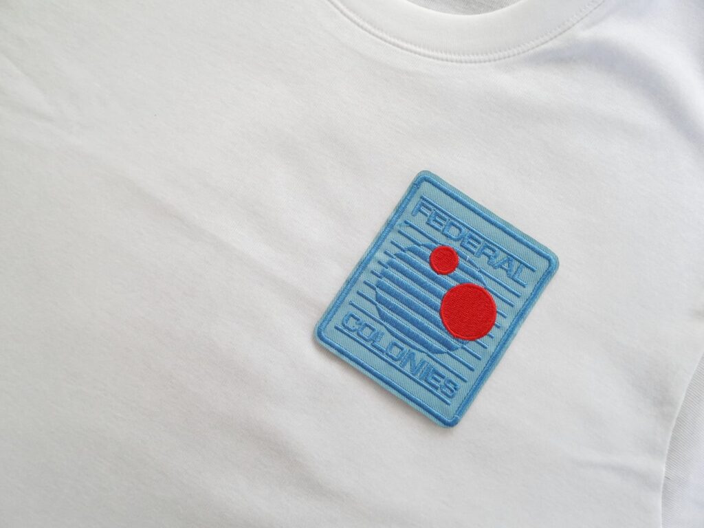 A shirt with a unique logo embroidered on it