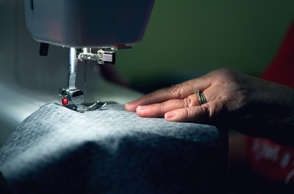 A person using an embroidery machine