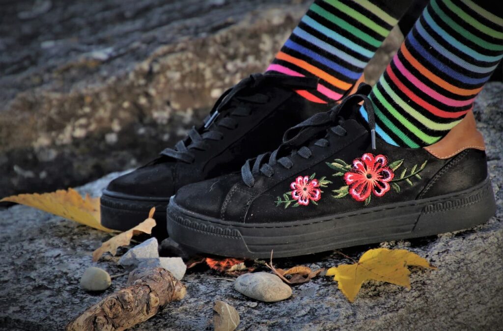 Black shoes with a flower embroidery design