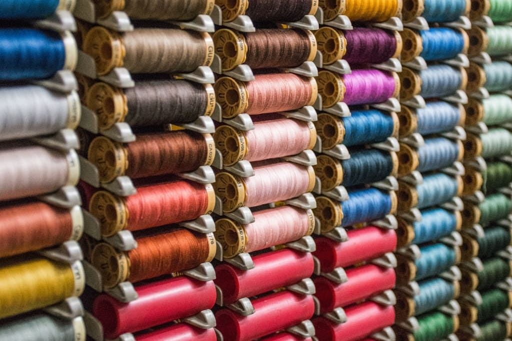 A collection of neatly arranged colored threads