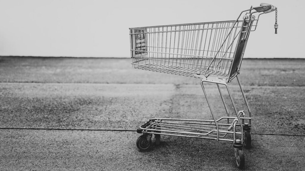 A monochrome image of an empty trolley cart
